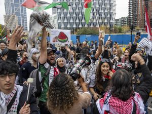 People take part in a Palestine Solidarity Campaign rally in central London in November