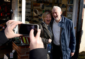 Mr Corbyn posed for selfies with fans as he walked down the high street
