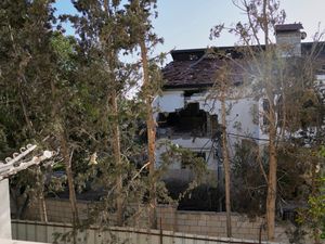 The impact of a projectile is visible on the wall of the building where the Briton was injured