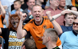 A fan celebrates Wolves' comfortable win over Bolton