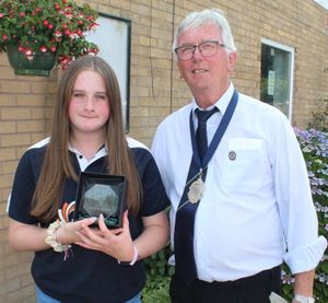 Home star - Holly Hotchkiss receives the Shropshire player-of-the-match award from county deputy president Andy Jones