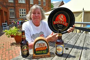 Charlotte Coxon poses with some Banks's memorabilia ahead of the festival