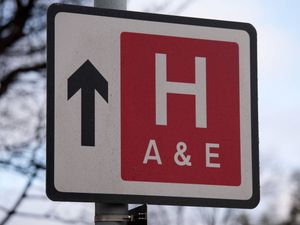 A street sign indicating a hospital