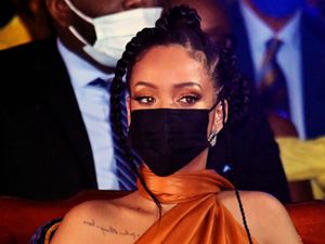 Supporting image for story: Rihanna shares photos of baby bump as she introduces her new ‘gang’