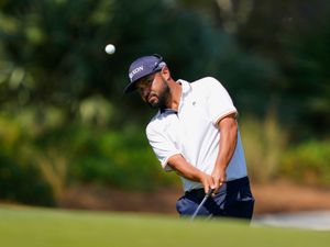 JJ Spaun hits a chip shot on to the second green during the third round of The Players Championship