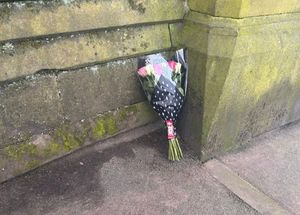 Flowers have been laid nearby