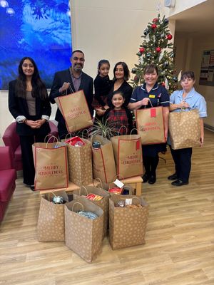 Amrik Singh from Vibrant Networks with staff from Goscote Hopsice