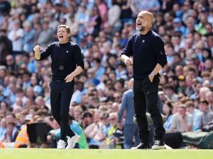 Crystal Palace manager Oliver Glasner (left) and Manchester City manager Pep Guardiola gesture on the touchline during the Premier League match at the Etihad Stadium,