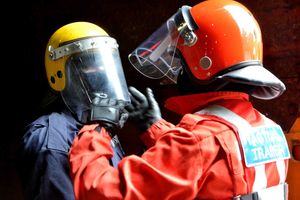 Juliet tries on the helmet