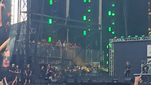 Heavy metal and rock musicians line up at side-of-stage to watch the show