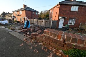 The scene at the home of Lynda Share, Cradley Road, Netherton, after a taxi crashed into her wall