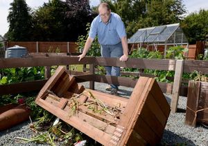 Fred Tice with an overturned planter