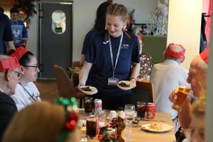 Telford College students serving a festive feast to members of the Dawley Dinner group at the college’s Orange Tree restaurant in Wellington.