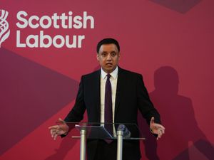 Anas Sarwar holding his hands apart as he makes a speech