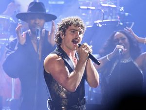 Benson Boone performing on stage