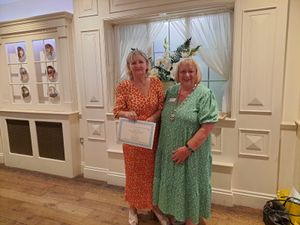 Jill Gooch receives her certificate from Lead Team President Carole Holdcroft