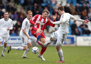 James Lawrie of Altrincham challenges Adam Farrell of AFC Telford United