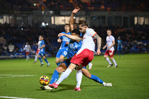 Charlie Lakin challenges for the ball. (Image by Owen Russell)