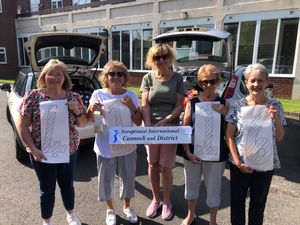 Soroptimists arrive with car loads of books!