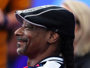 Supporting image for story: Snoop Dogg unveils Swansea kit in playful dig at Wrexham owner Ryan Reynolds