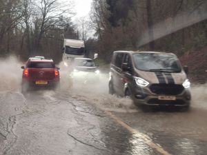 Traffic pushing through standing water on the Welshpool-Shrewsbury road on Tuesday afternoon. Photo: Barry Evans