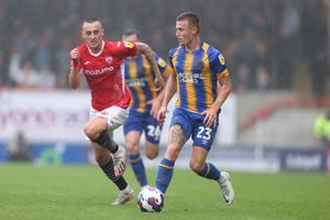 George Nurse of Shrewsbury Town and Dylan Connolly of Morecambe (AMA)