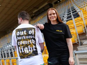 Foundation staff Dan and Grace model the new t-shirts.