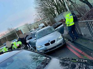 Supporting image for story: Moment police arrest three men after cornering BMW in West Bromwich following £500,000 jewellery theft