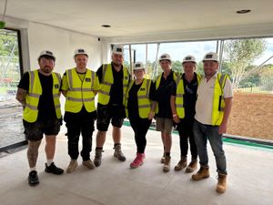 Staff from Shrewsbury-based Shuker construction during a DIY:SOS project for children's charity The Joshua Tree