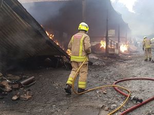 Supporting image for story: Cows are led to safety in barn blaze