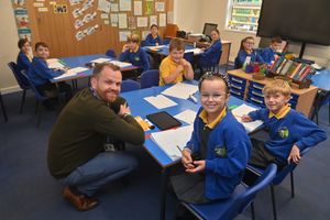 Headteacher Ross Shepherd with Phoebe, Alfie and Angus (front table)