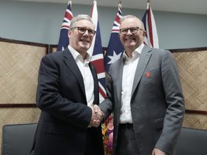 Sir Keir Starmer shaking hands with Anthony Albanese
