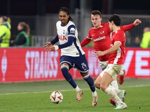 Djed Spence (left) in action for Tottenham