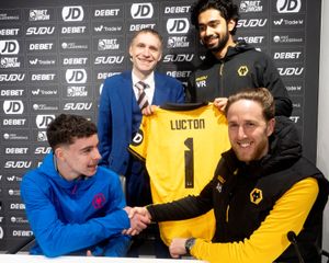 Student Archie Grogan, 16, shaking hands with Asa Hall, watched by Lucton Headmaster Andrew Allman and coaching staff member Vai Ramesh
