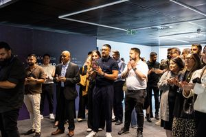 Guests applaud after hearing the introductory speech from Harmish Chander.