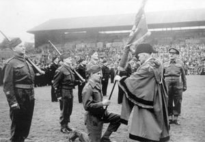 Mayor of Wolverhampton, Councillor T W Phillipson pictured with members of the Home Guard contingent celebrating VE Day at Molineux