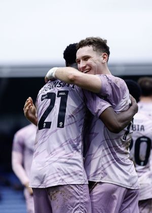 Trey Ogunsuyi celebrates with Shrewsbury Town team-mate Iwan Morgan d