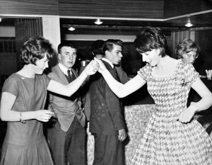 Teenagers dancing, likely at Shrewsbury Youth Club as '...SBURY YO..' can be seen in the background. This is undated but possibly early 1960s. This print is totally blank on the back. 