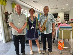 Emma Wilde from Age UK Shropshire Telford and Wrekin welcomes Neil Brookes and Dave Chesters to Withywood Dementia Respite Group.