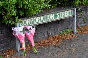 Flowers have been laid in Corporation Street after the deaths of two children sparked a murder investigation. Photo: Tim Thursfield