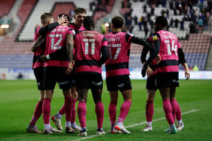 Dan Udoh of Shrewsbury Town celebrates with his team mates after scoring a goal to make it 1-1 (AMA)