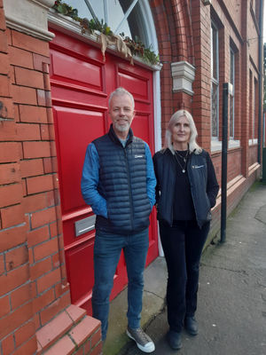Paul Newman and Adele Nightingale outside Oswestry Memorial Hall, that runs many evening activities. Picture: LDRS