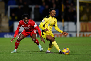 Tunmise Sobowale of Shrewsbury Town and Bobby Kamwa of Burton Albion (AMA)