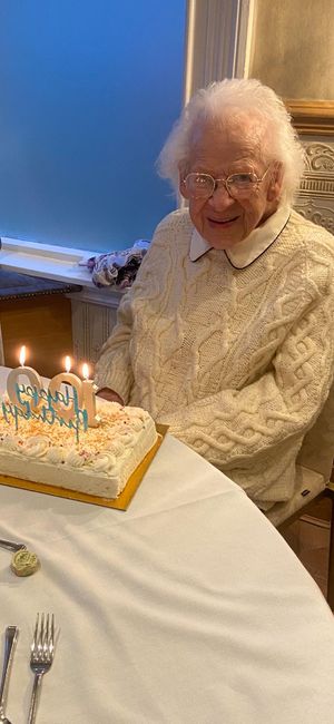 Joan Dabbs sat with her 100th birthday cake. 