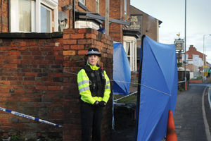 Police outside Khan's flat on Wolverhampton Road
