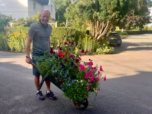 Paul Greatbatch wheeling the barrow