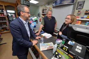 Postal affairs minister Paul Scully chats to sub-postmaster Steve Bentley and his step-daughter Katie Baker