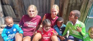 Claudia and Anna Gwilt with youngsters in Mathare.
