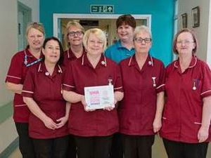 Supporting image for story: Spinal injury specialists honoured with national award