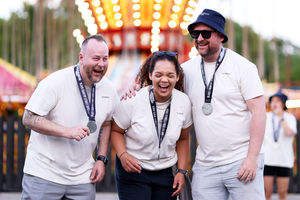 Employees from Pluxee with their medals for taking part in the sixes networking event and game